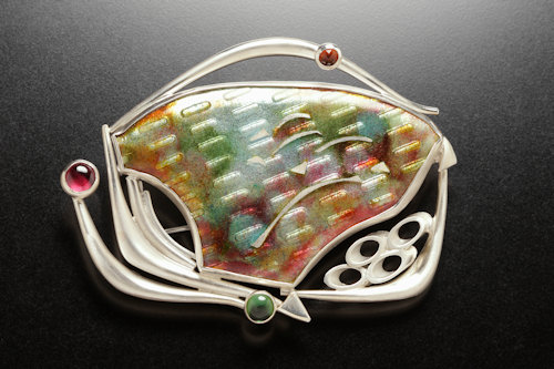 high fired cloisonne enamel over embossed fine pure silver with hand cut cloisonne. 